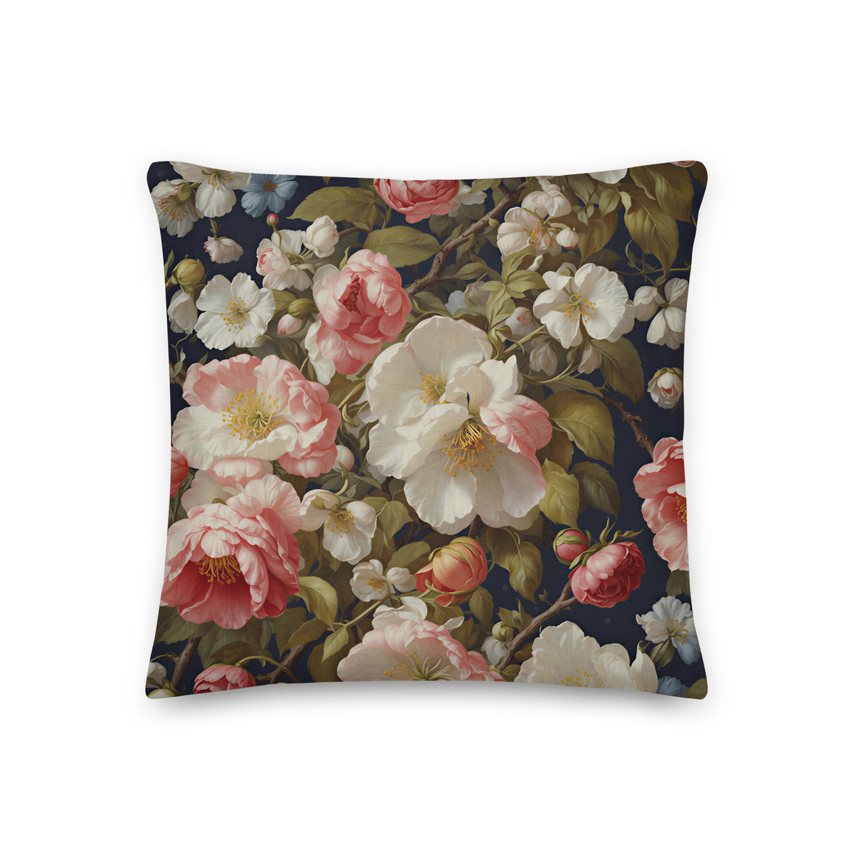 Dark botanical cushion with blush-pink and ivory flowers, olive-green foliage and branches on a deep navy background.