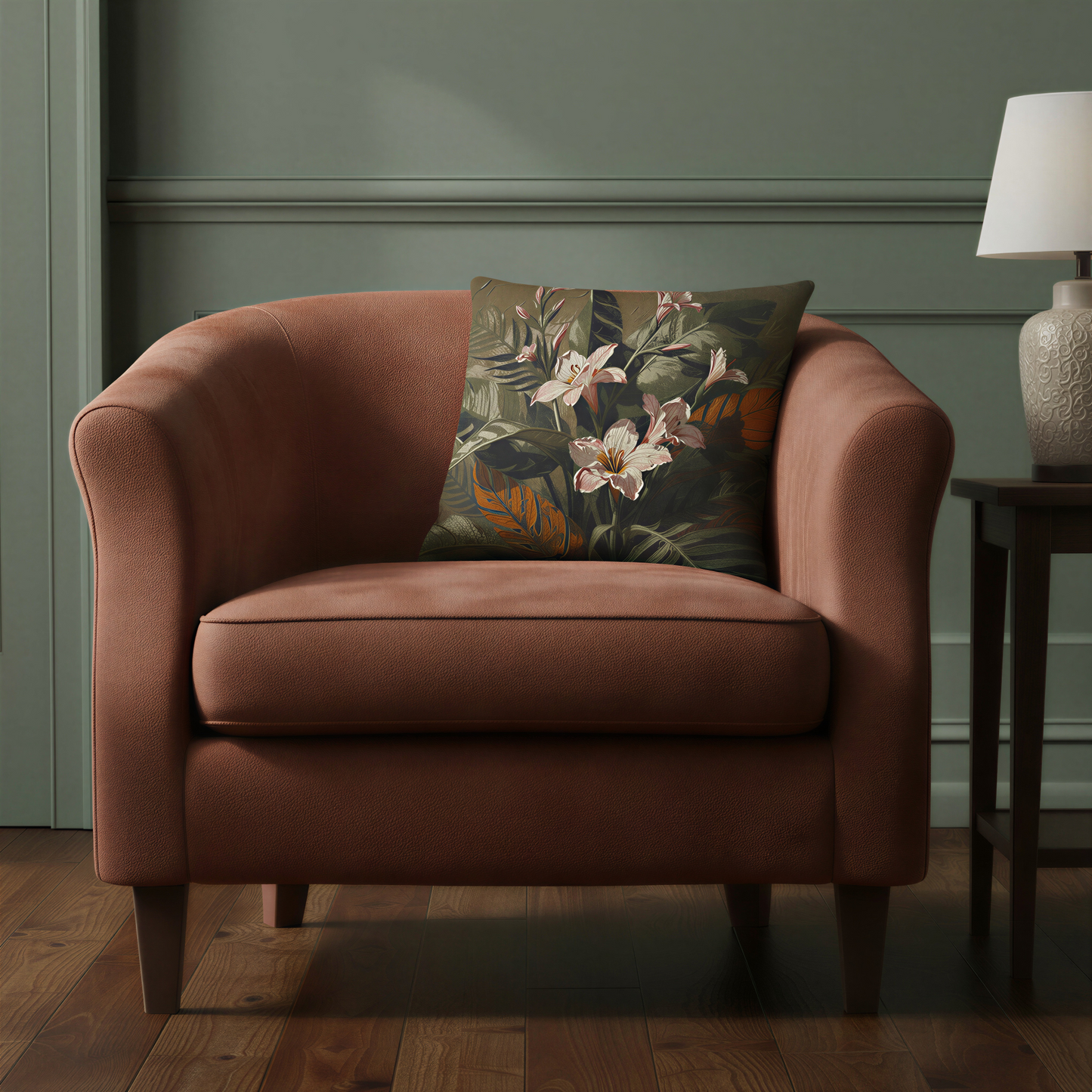 Square cushion displaying painterly botanical artwork with pink freesia blossoms, unopened flower buds and layered tropical leaves in olive green, charcoal and terracotta shades.