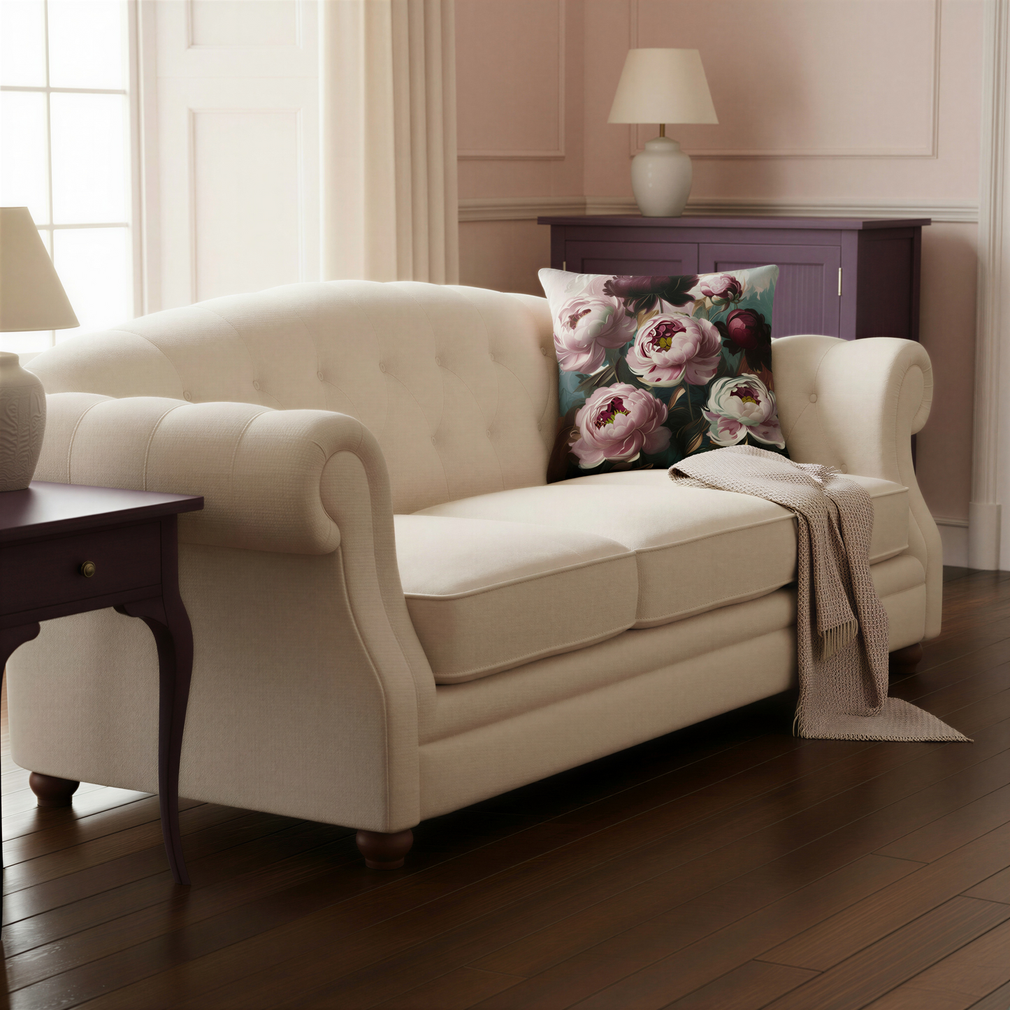 Floral scatter cushion displaying oversized blush-pink peonies with layered petals, burgundy centres and dramatic dark plum noir flowers in a richly painted botanical arrangement.