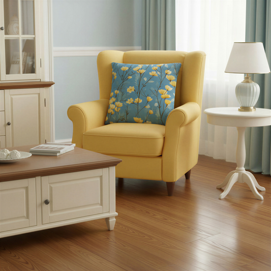 Square decorative cushion featuring yellow wildflowers on slender dark stems against a blue background with pale blue-green foliage.